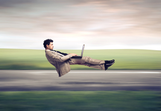 floating-man-with-laptop-applying-for-accelerated-underwriting-life-insurance