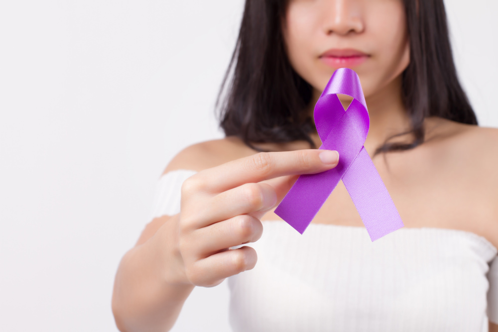 lady holding a lupus awareness ribbon